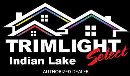 Logo for Trimlight Indian Lake Select, showing two house outlines with rainbow-colored roof trim. Trimlight Indian Lake Select is written below, with Select in red, and Authorized Dealer at the bottom.